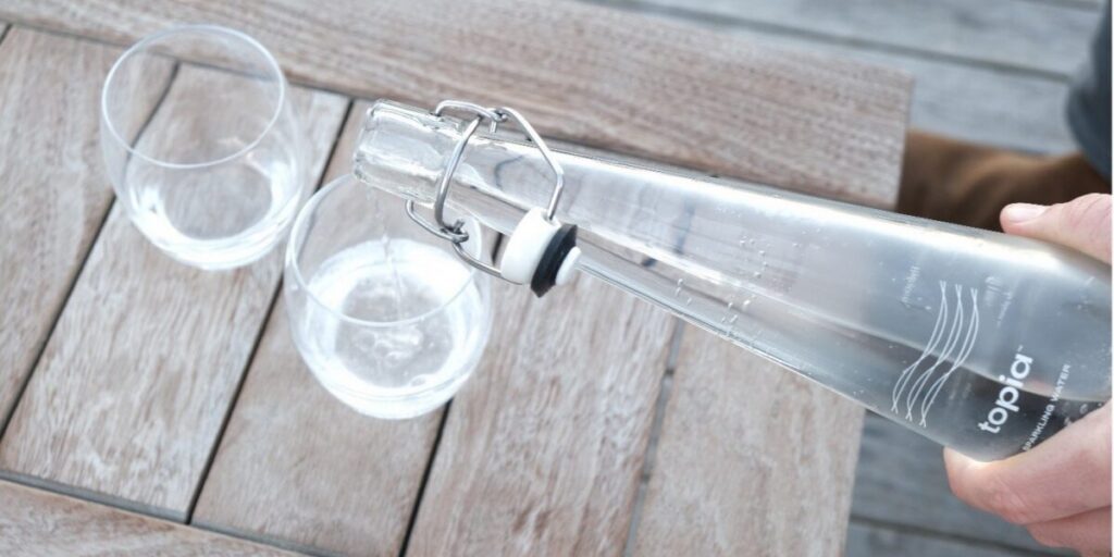 Pouring Filtered Topia Water Into Glasses
